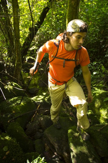 Grant Bemis making use of a stream bed as a thoroughfare through the forest. Photo by James Q Martin.  